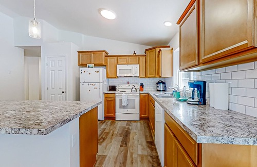 Crescent House | Enchanting 10-acre retreat with waterfront views & spacious deck