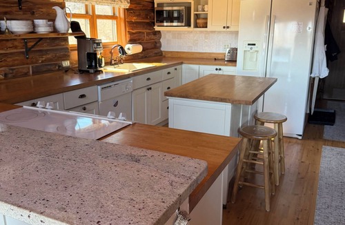 Swain House | Enjoy an updated classic log cabin with ski slope views from the hot tub.