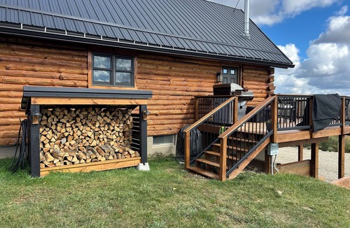 Swain House | Enjoy an updated classic log cabin with ski slope views from the hot tub.