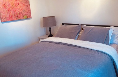 Souderton Apartment | Enjoy comfort, convenience, and a peaceful setting in this beautifully bedroom