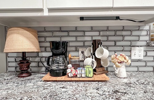 Gainesville House | Enjoy farmhouse charm in this 4-bedroom, 2-bath ranch retreat just minutes from downtown Gainesville, the Frank Buck Zoo, and local parks. Sleeping up to 10, it’s perfect for families or group getaways, offering a bright open layout and cozy country