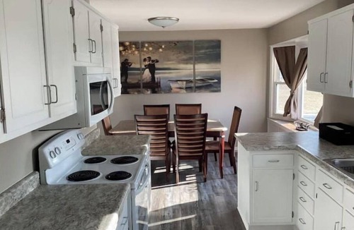 Altoona House | Enjoy golf course views with hot tub and fire pit.