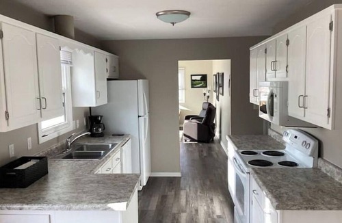 Altoona House | Enjoy golf course views with hot tub and fire pit.