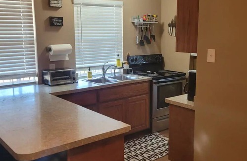 Dennis Cottage | Enjoy the river with a pool, firepit and a balcony with a gorgeous water view.