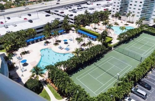 Golden Beach Condo | Entire condominium with a pool view, steps from the beach