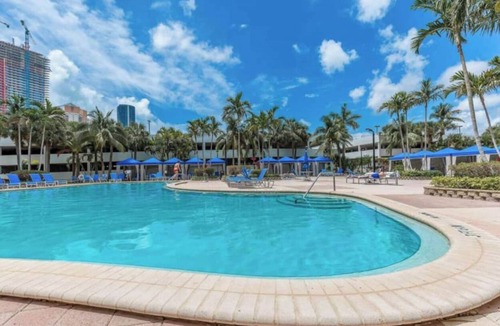 Golden Beach Condo | Entire condominium with a pool view, steps from the beach
