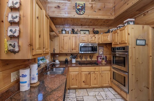 Pigeon Forge Cabin | Ern854 - Wagon Wheel Lodge - Great Location! Close To All The Action! 9 Bedroom Cabin by RedAwning