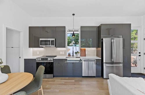 Young Harris Apartment | Escape to a 2BR/1BA tiny home in the N Georgia mountains. Cook meals, cozy up by the wood-burning stove, refresh in the spa-style shower, and enjoy crisp winter mountain air from your private deck. Perfect for city escapes and romantic weekends.