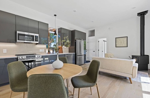 Young Harris Apartment | Escape to a 2BR/1BA tiny home in the N Georgia mountains. Cook meals, cozy up by the wood-burning stove, refresh in the spa-style shower, and enjoy crisp winter mountain air from your private deck. Perfect for city escapes and romantic weekends.