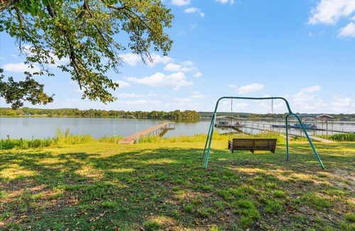 Bowie Cabin | Escape to a Cozy Lakefront Cabin on Lake Amon Carter with Private Dock