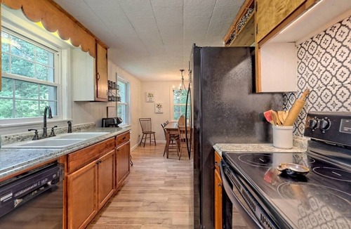 Scaly Mountain House | Escape to nature with this pet-friendly, family retreat just 15 minutes from Highlands! Perfect for hiking, relaxing, and playtime with the kids. Utilize the outdoor fire pit, indoor fireplace and the playhouse in the side yard full of games!