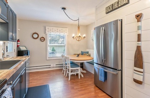 Wolcott House | Escape to our cozy 2-BR lakefront cottage on East Bay! Sleeps 6.