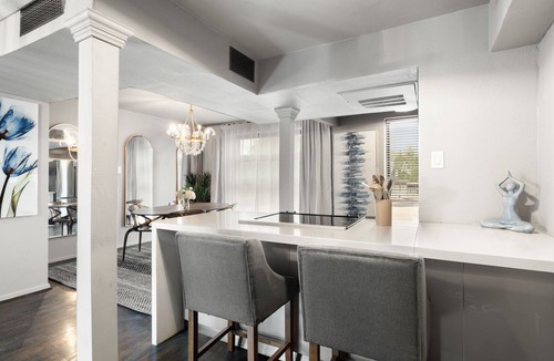 Old East Dallas Condo | Expansive 2-bed loft with fireplace, full kitchen, smart TVs, sofa bed, and access to an award-winning courtyard & resort pool.