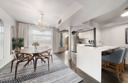 Old East Dallas Condo | Expansive 2-bed loft with fireplace, full kitchen, smart TVs, sofa bed, and access to an award-winning courtyard & resort pool.