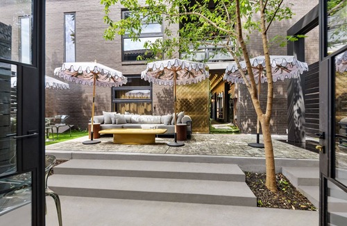 Old East Dallas Condo | Expansive 2-bed loft with fireplace, full kitchen, smart TVs, sofa bed, and access to an award-winning courtyard & resort pool.