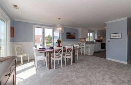 Falmouth House | Expansive deck with ocean views