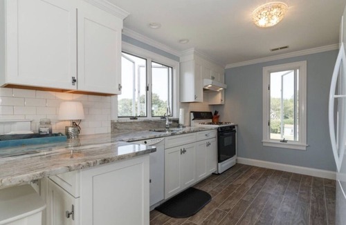 Falmouth House | Expansive deck with ocean views