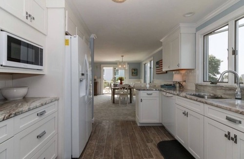 Falmouth House | Expansive deck with ocean views