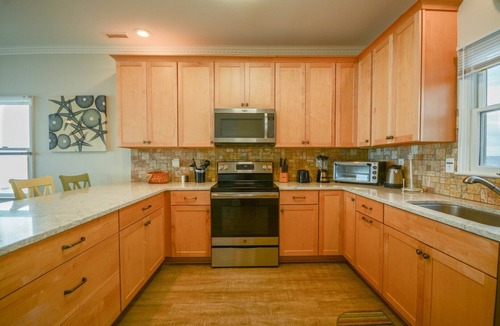 Surf City House | Experience beachfront luxury at C-Scape in Surf City, NC. Sleeps 14!