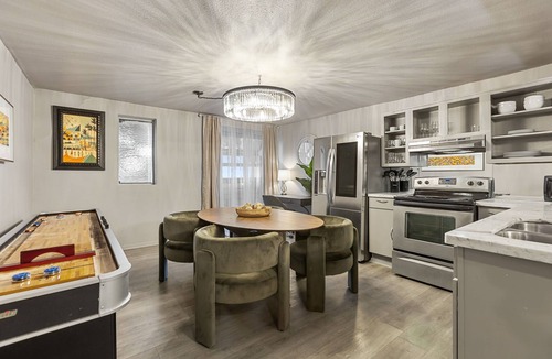 Old East Dallas Condo | Experience elevated living in this executive 2-bed, 1.5-bath furnished condo featuring a private garden-view patio. Enjoy resort-style amenities including a pool, sauna, cold plunge, and outdoor fitness deck. Perfect for extended stays!