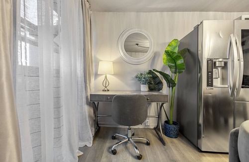 Old East Dallas Condo | Experience elevated living in this executive 2-bed, 1.5-bath furnished condo featuring a private garden-view patio. Enjoy resort-style amenities including a pool, sauna, cold plunge, and outdoor fitness deck. Perfect for extended stays!