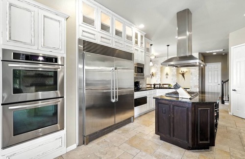 Rocky Ridge House | Experience luxury on Lake Travis! Enjoy stunning lake views, a private pool, spa, fire pit, and plenty of space for the whole crew. This gated retreat sleeps 17+ and features a chef’s kitchen, bar, media room, game room, dedicated office, playscape,