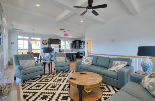Yaupon Beach House | Experience ocean views at Blue Waves, a spacious 4-bedroom home in Oak Island!