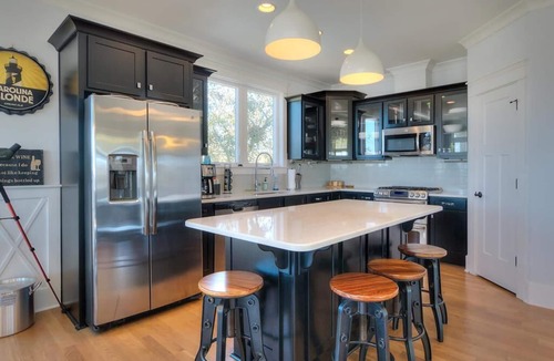 Yaupon Beach House | Experience ocean views at Blue Waves, a spacious 4-bedroom home in Oak Island!