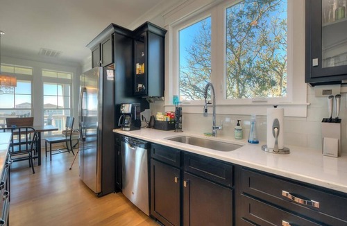 Yaupon Beach House | Experience ocean views at Blue Waves, a spacious 4-bedroom home in Oak Island!