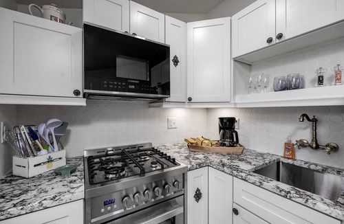 East of Broadway Apartment | Experience the Historic Armstrong Cottage in the Sunshine Suite