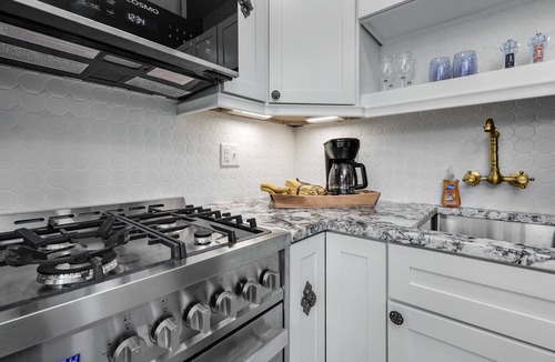 East of Broadway Apartment | Experience the Historic Armstrong Cottage in the Sunshine Suite