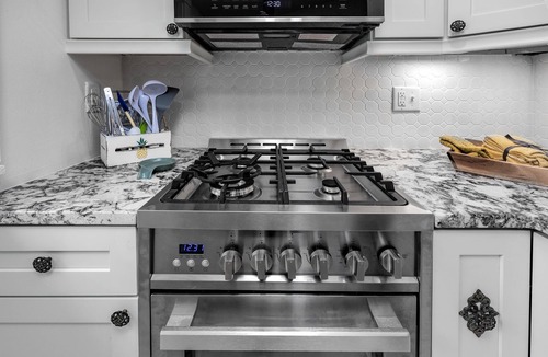 East of Broadway Apartment | Experience the Historic Armstrong Cottage in the Sunshine Suite