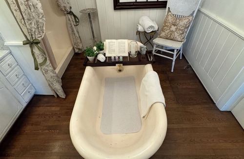 Montgomery Bed & Breakfast | Experience the historic Suite Louise with a parlor and claw tub.