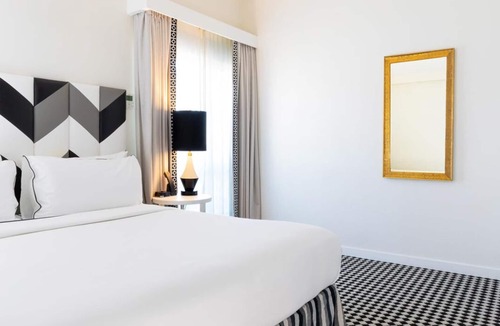 Norma Triangle Hotel | Explore An Exotic Three Unit Stylish Suite with Rooftop Pool! Pet-friendly!