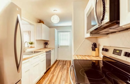 Bayou Oaks House | Exquisite bungalow with shared pool, washer & dryer, and WIFI