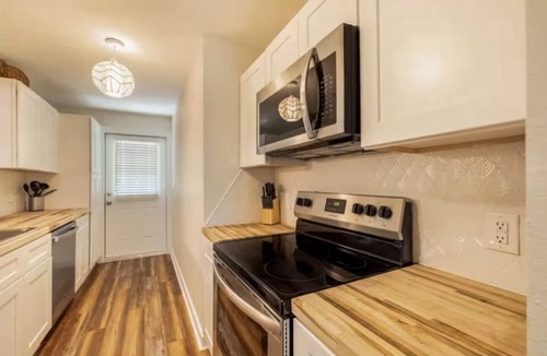 Bayou Oaks House | Exquisite bungalow with shared pool, washer & dryer, and WIFI