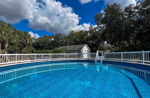 Bayou Oaks House | Exquisite bungalow with shared pool, washer & dryer, and WIFI