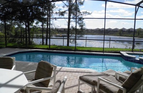 Windsor Hills House | Fabulous Lake View/South Facing Pool Home- Game room -2 Miles to Disney!