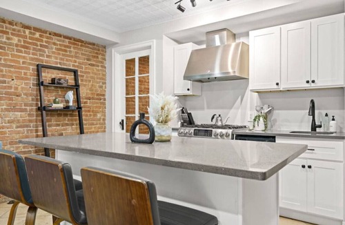 Central Park North Villa | Family Brownstone with Private Backyard Near Subway