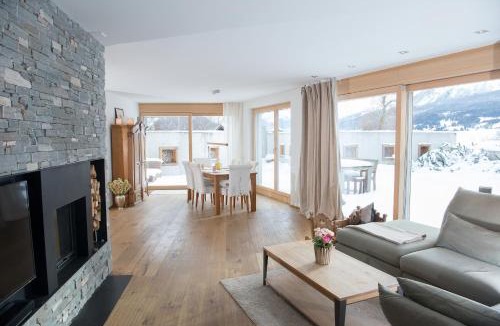 Grisons Apartment | Family oasis with garden and fireplace