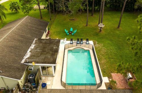 Palm Beach Country Estates Villa | Family Retreat Firepit Htd Pool Massive Yard Sleeps 12