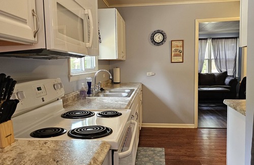 Prudenville House | Family sized updated cottage with garage -Fenced in yard for pets.