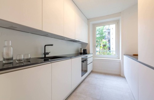 District 6 Apartment | Family Suite · Familienwohnung mit Rutsche