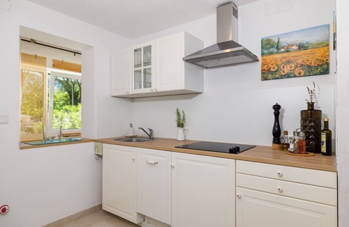 Tribalj Apartment | Fantastic apartment with pool, Mediterranean garden, barbecue, cot, WiFi