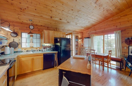 Orland House | Fantastic property on the pond with firepit, wraparound deck, & kayaks