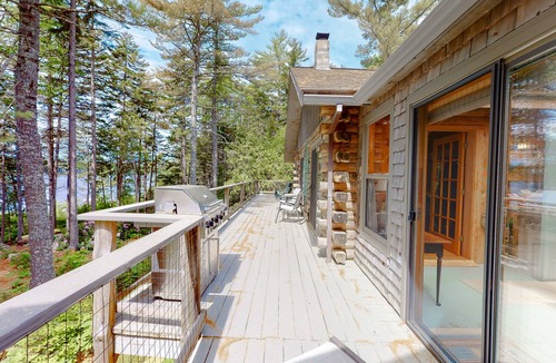 Orland House | Fantastic property on the pond with firepit, wraparound deck, & kayaks