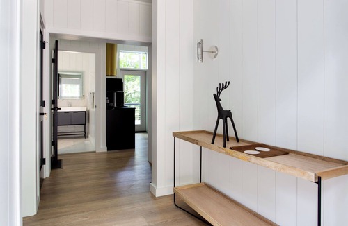 Loudonville Cabin | Fauna Bluff, A cliffside 2-bedroom modern cottage overlooking a bubbling stream.