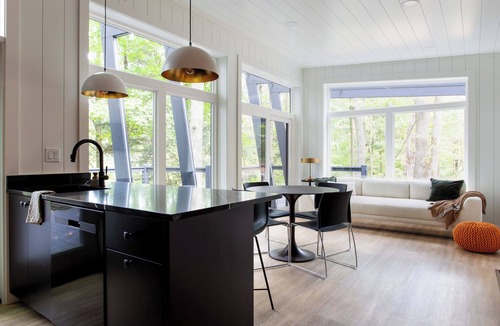 Loudonville Cabin | Fauna Bluff, A cliffside 2-bedroom modern cottage overlooking a bubbling stream.