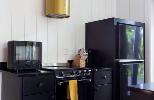 Loudonville Cabin | Fauna Bluff, A cliffside 2-bedroom modern cottage overlooking a bubbling stream.