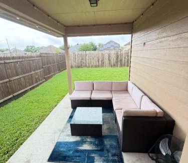 Porter House | FIFA World Cup Retreat Cozy Modern Home Covered Patio With TV